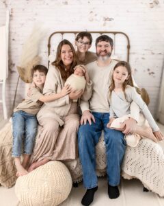 Family posing together for newborn session at danielle ashley photography in medina ohio