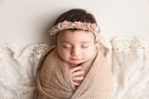 older newborn in the studio being safely photographed by a cleveland newborn photographer 