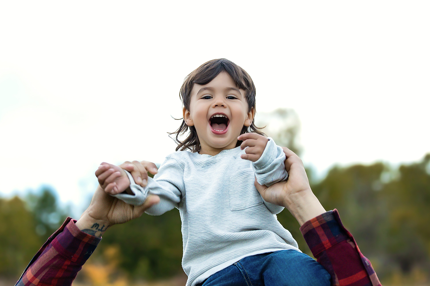 Smiling toddler playing happily in a positive, faith-filled environment