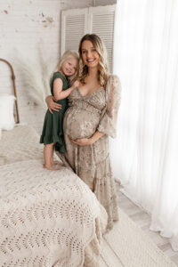 Emotional maternity portrait of a mother and daughter in a Northeast Ohio studio