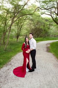 Family walking along rolling fields and wooded trails at Allardale Park in Medina County Ohio during spring family photography session.