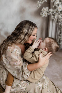 Mother and child sharing a meaningful foot washing moment during Easter mini session in Medina, Ohio.