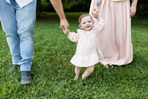 Visual guide for spring family photo outfits with examples of coordinated clothing in blush, cream, sage, and denim for a cohesive look